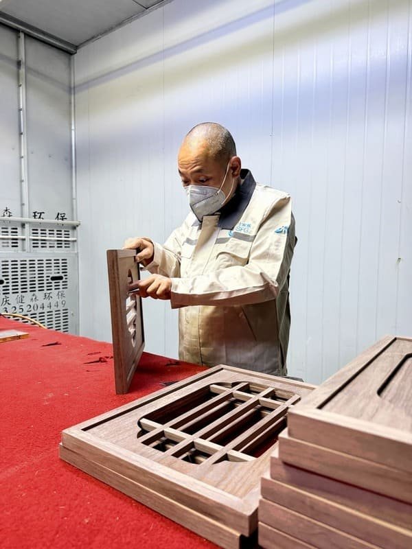 Custom woodwork sanding process at Horace Home factory