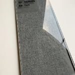 Grey fabric-texture glass surface with translucent finish