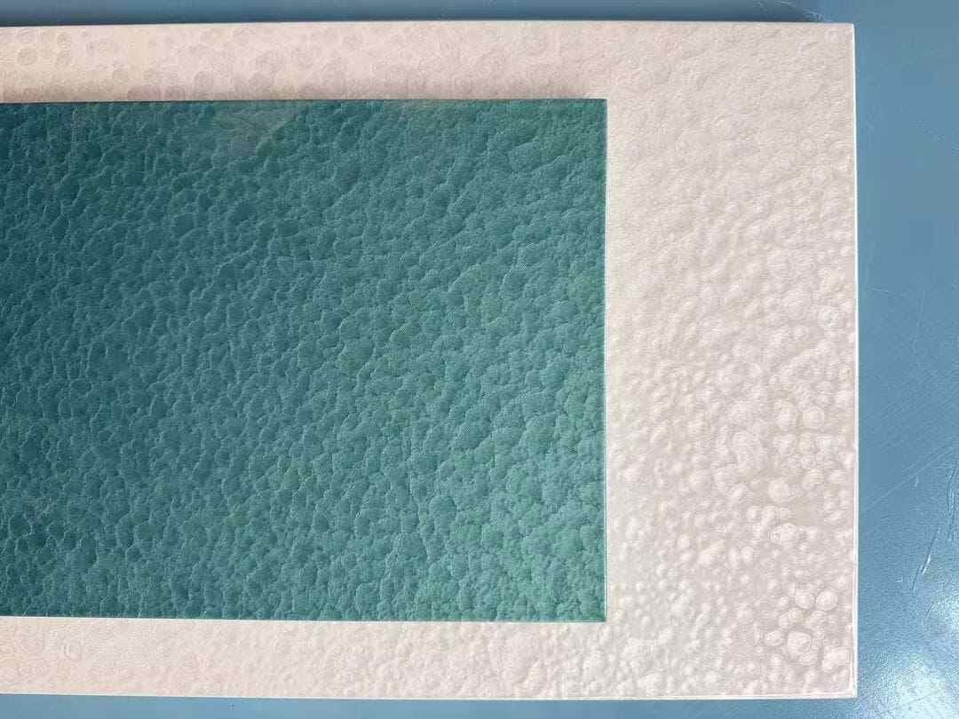 Lacquer finish samples with textured solid color surfaces