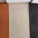 Leather finish samples in brown, cream, and black colors