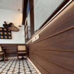 Warm LED strip lighting used along wood wall panels