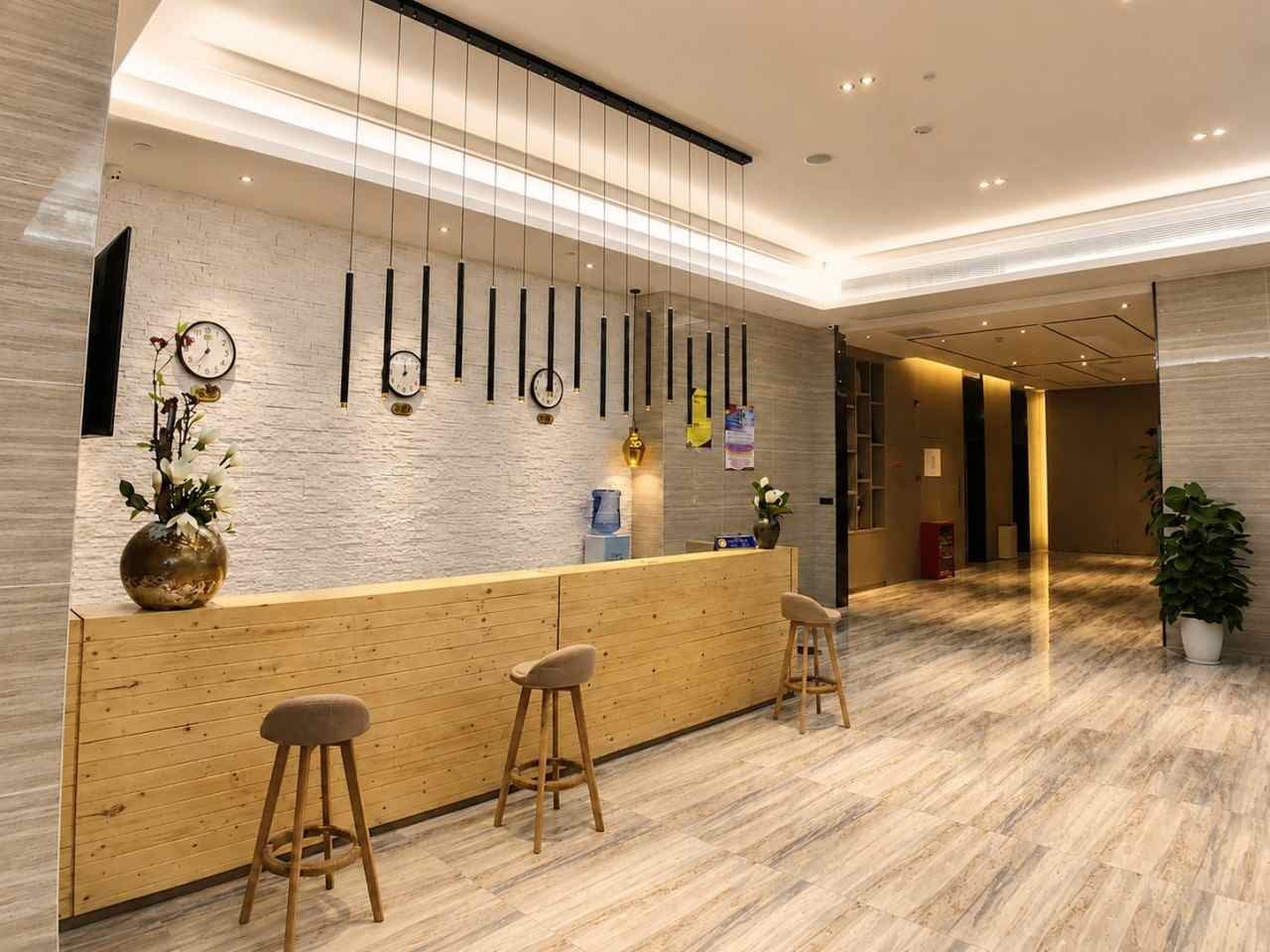 Xikelai Hotel lobby bar counter with custom woodwork