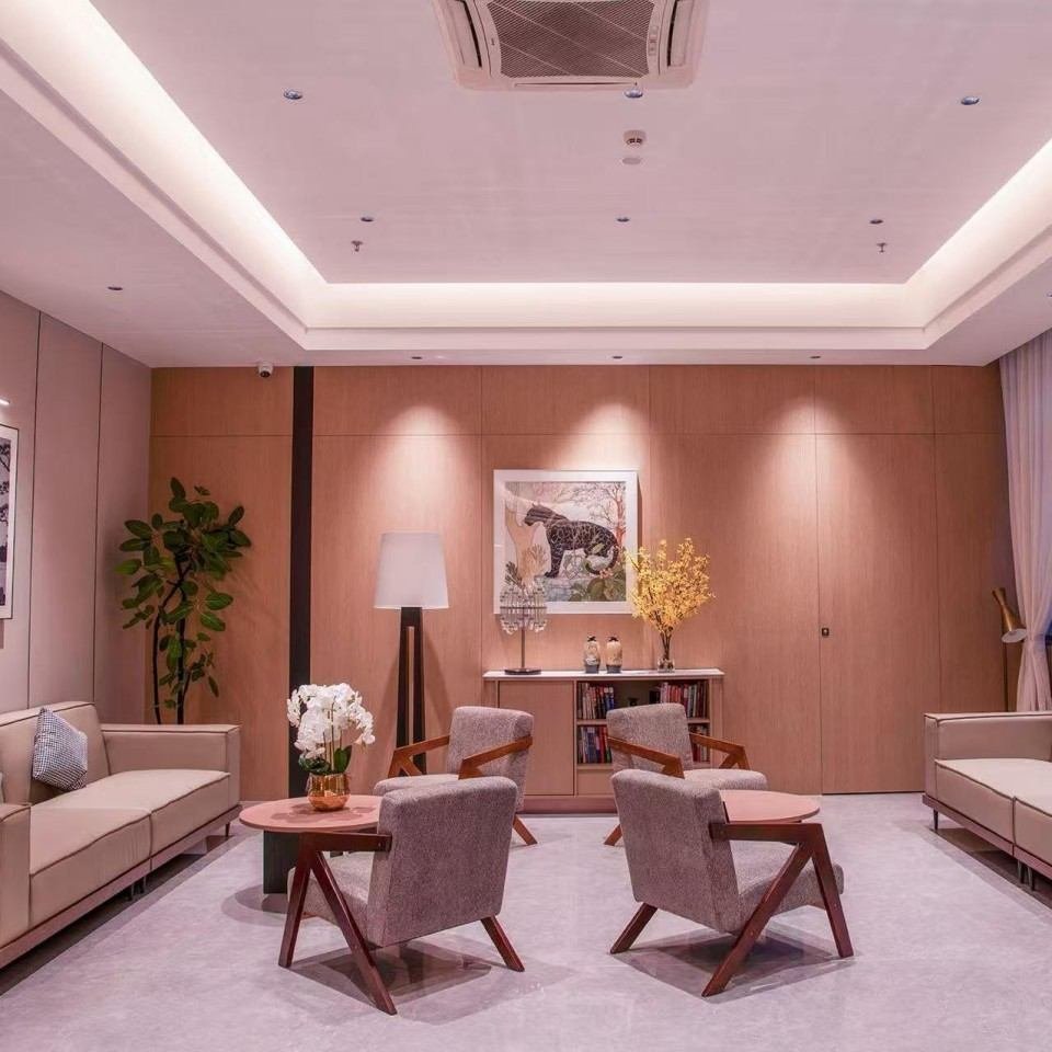 Banshan Hotel lounge area with custom wood wall panels and seating