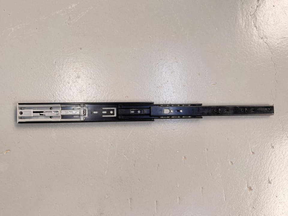 Push-to-open drawer slide for handleless drawer systems