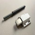Push-to-open latch for handleless cabinet door opening