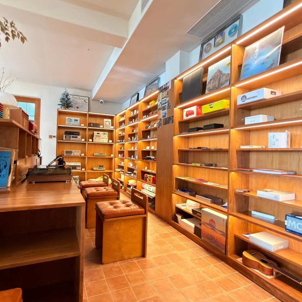 Whale Island Music shelf display area with custom wooden shelving