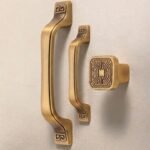 Surface-mounted cabinet pulls in antique brass finish