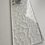 Ultra-clear textured glass surface with frosted decorative pattern