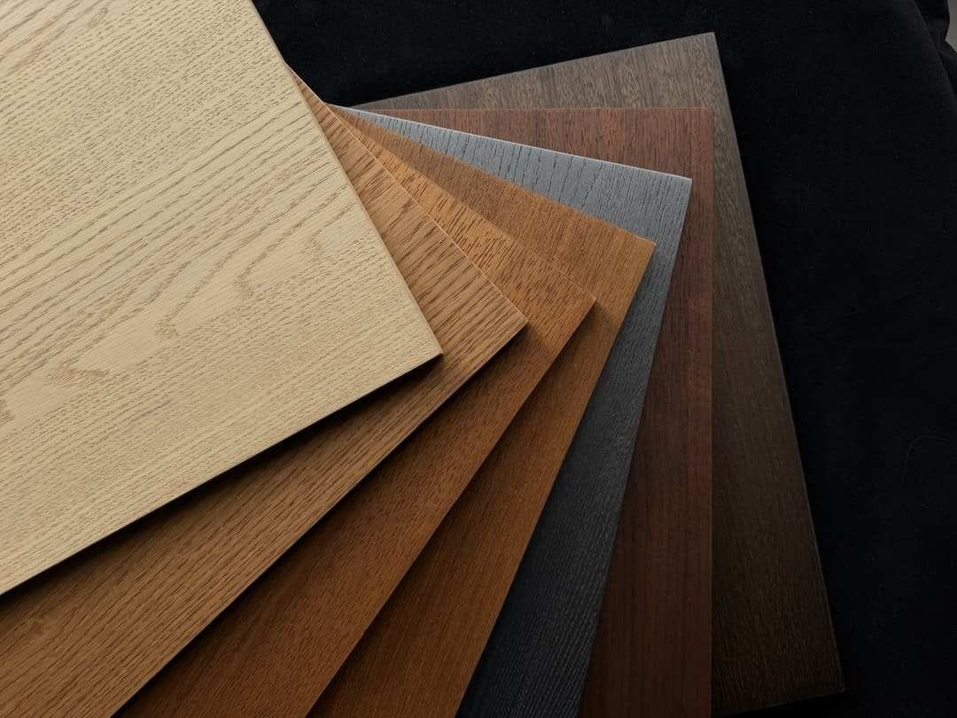 Wood veneer finish samples with different wood tones and grain surfaces