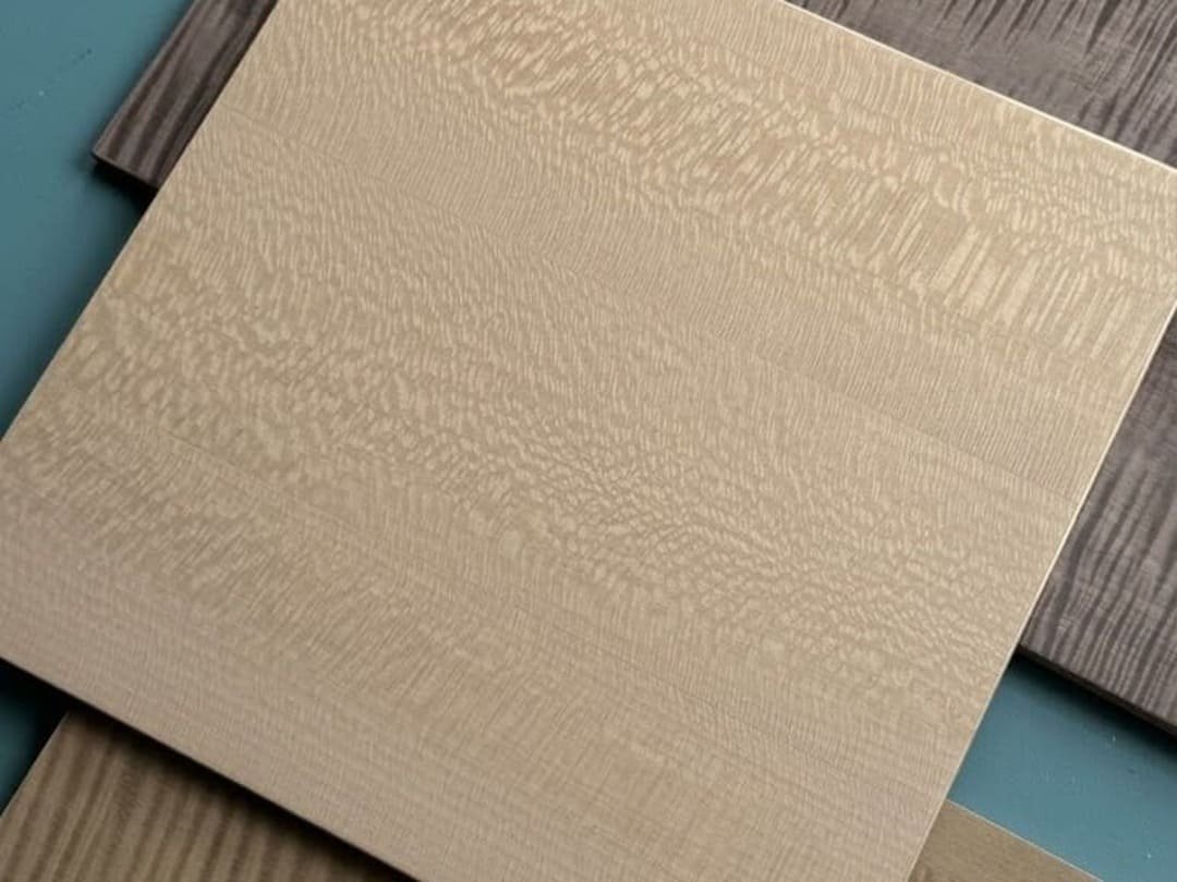 Wood veneer finish sample with light natural grain texture