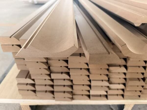 Stacked MDF decorative mouldings with routed grooves and shaped profiles