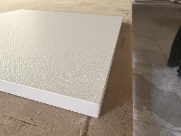 White textured panel sample with 1 mm PVC edge banding prepared for PUR adhesive testing