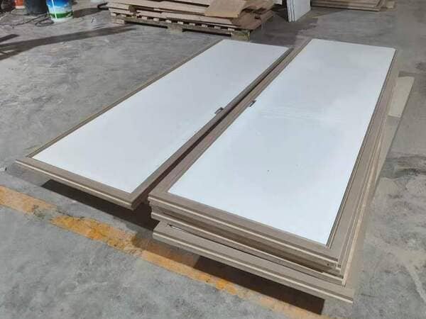 3.9 m high aluminum honeycomb cabinet door panels after plywood lamination in the factory.
